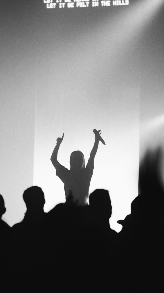 Dancing crowd in a dark venue for the programme section